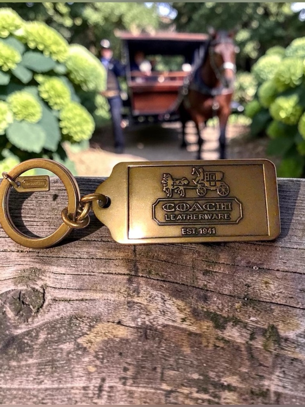 Coach brass keychain stamped Coach leatherware horse and carriage